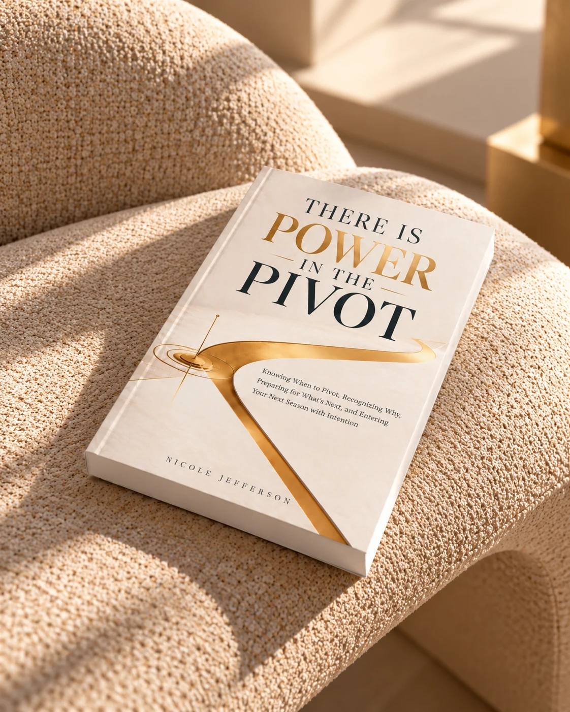 There Is Power in the Pivot book resting on a warm cream textured chair